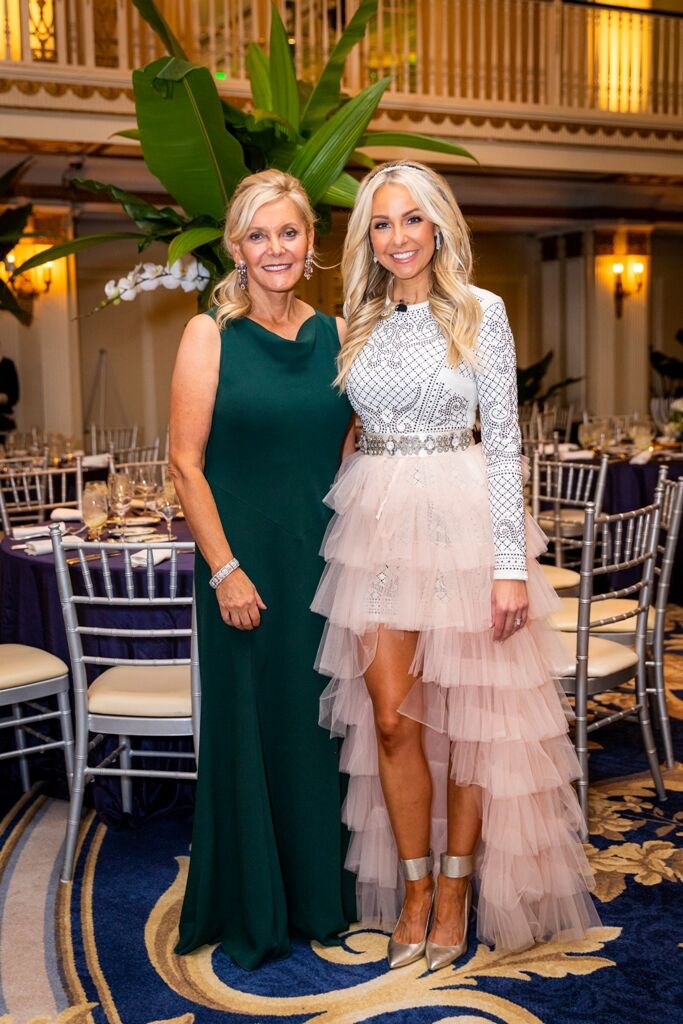 PAWS Founder Paula Fasseas with Grand Ballroom emcee Natalie Bomke.